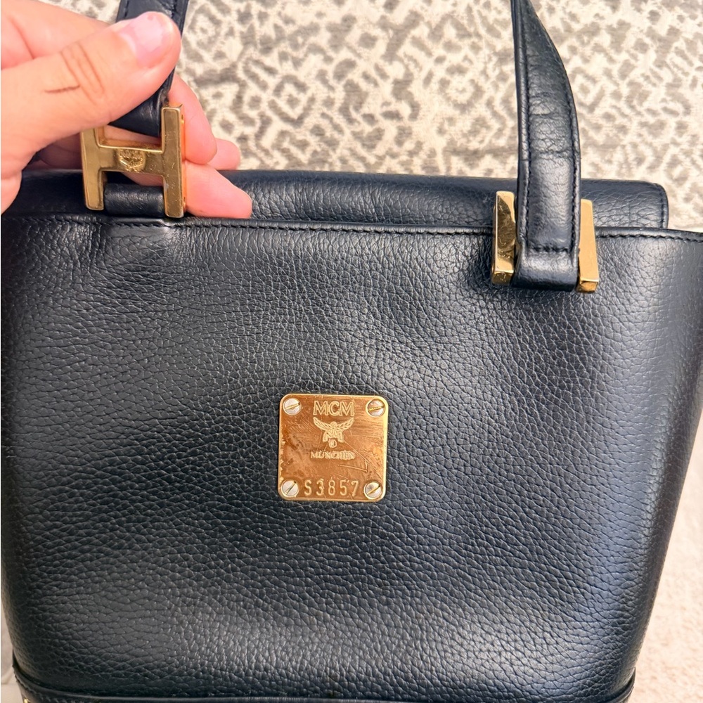 MCM Black Leather Shoulder Bag with Gold Accents